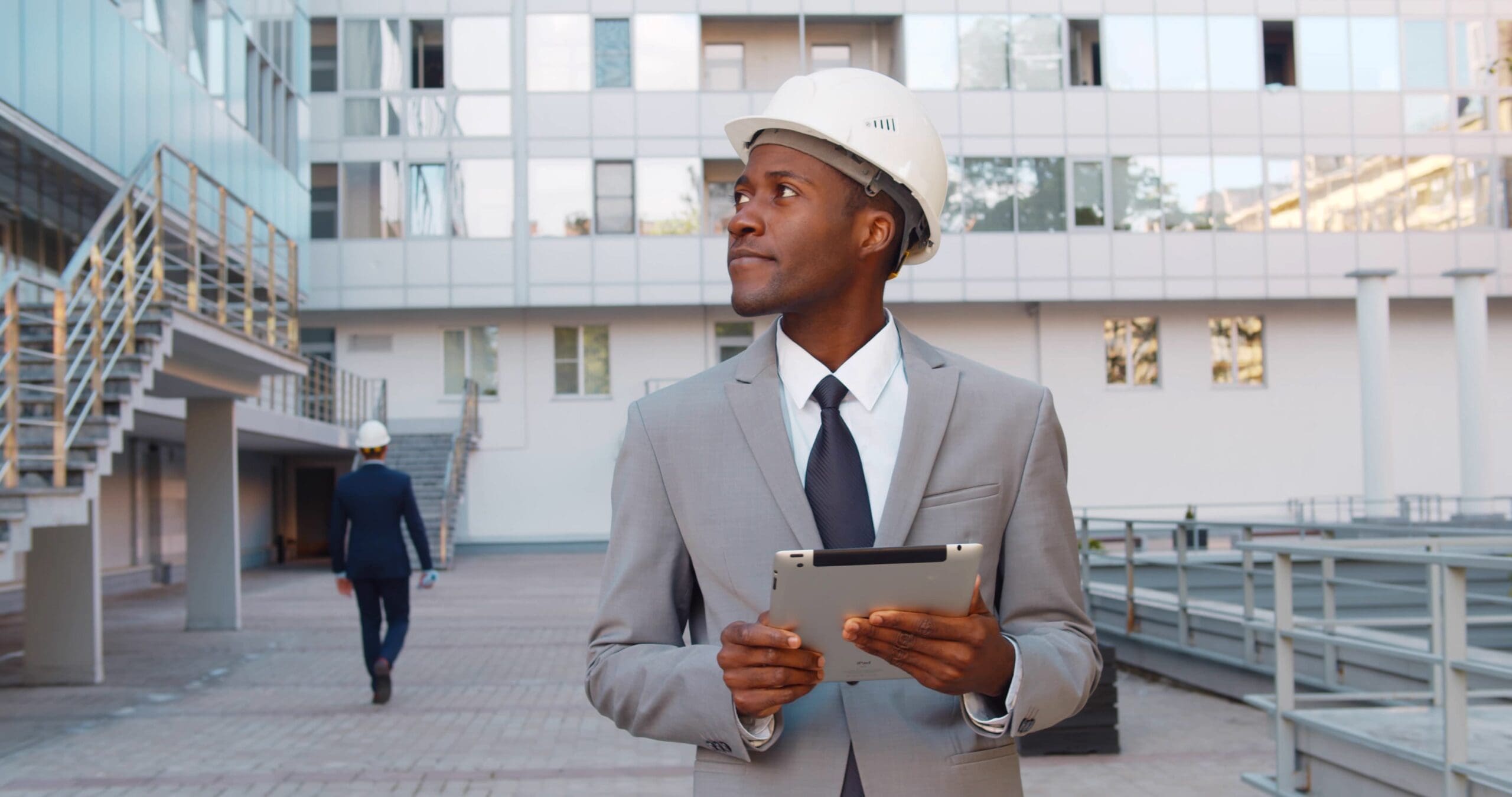 First-time real estate investor looking over construction while holding a checklist