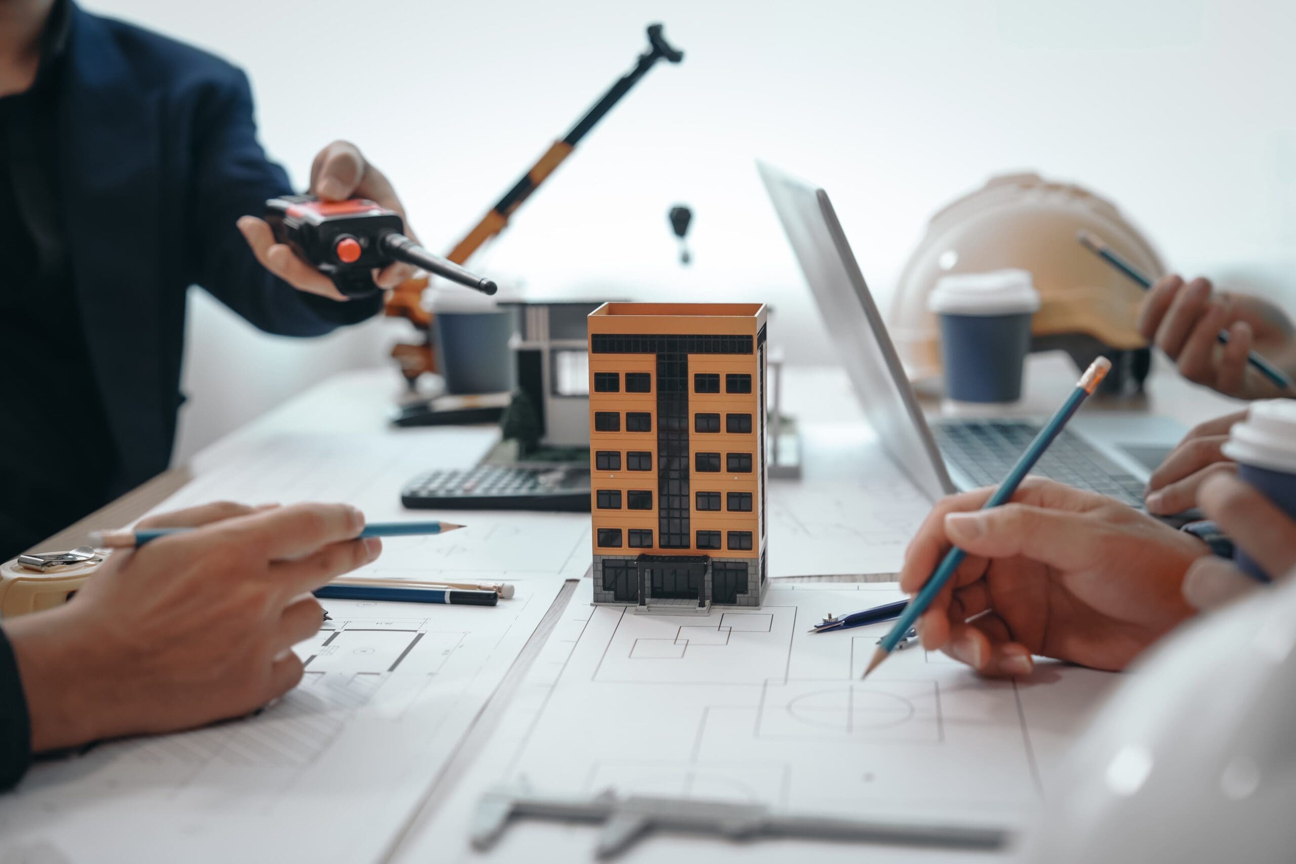 Project managers looking over building codes
